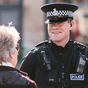 Male officer talking to a member of the public