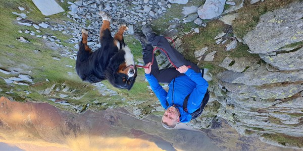John Wood in the mountains with his dog