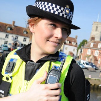 Female officer using her body radio