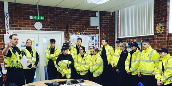 Cadets in a briefing room, listening to their Cadet Leader