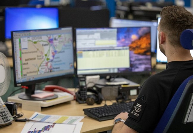 Resource and Incident Management Officer looking at his computer screens
