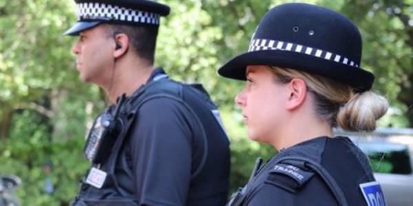 Head & shoulder side view of two officers standing next to each other