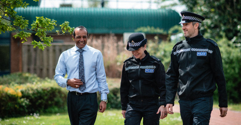 Three officers walking and chatting together
