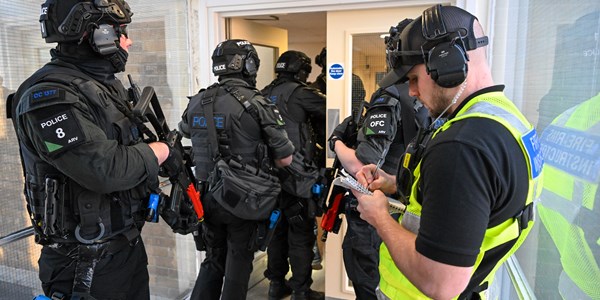Firearms Instructor with armed officers in hallway