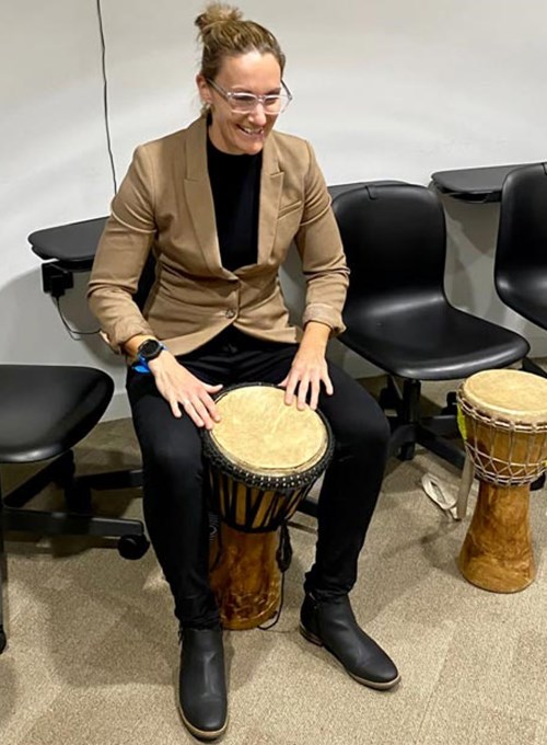Playing a djembe