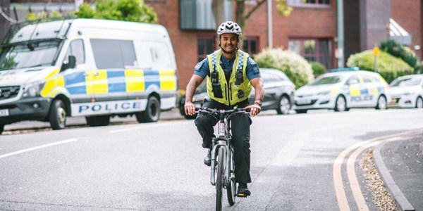 A PCSO riding a bike